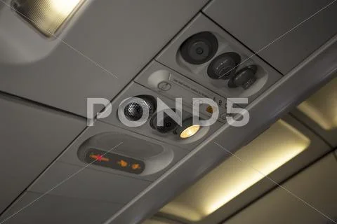 Aircraft airline passenger overhead vent light warning Stock Photos