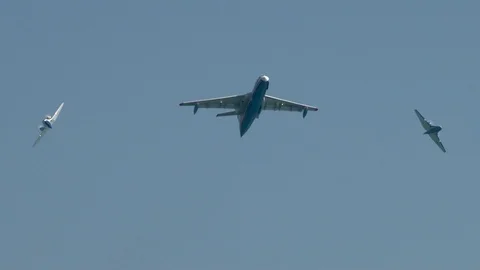 Aircraft Be-200ES performs  flight accompanied by two Be-103 . Stock Footage 124191507