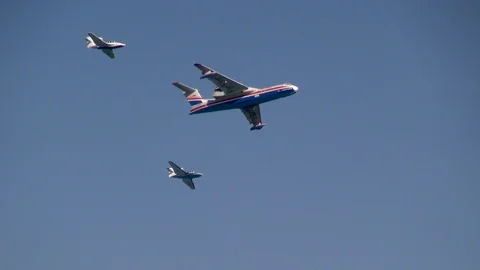 Aircraft Be-200ES performs  flight accompanied by two Be-103 . Stock Footage 124644080