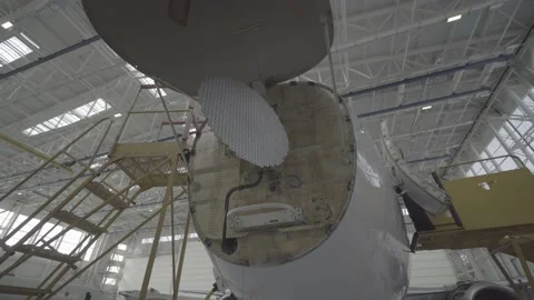Aircraft being repaired in the hangar Stock Footage 164475641