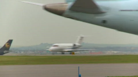 Aircraft, Canadair CL-600-2B16 Challenger 604 takeoff, follow tight frame Stock Footage