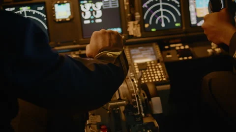 Aircraft captain in command throttling engine handle to takeoff Stock Footage 195290944