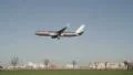 Aircraft coming in to land over a busy road HD Footage