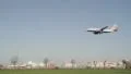 Aircraft coming in to land over a busy road HD Footage