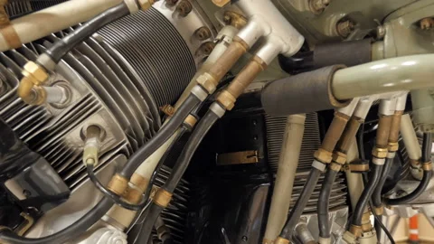 Aircraft construction. Close-up piston engine aircraft with radiators and pipes Stock Footage 90257058