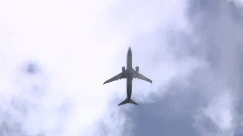 Aircraft disappear through clouds Stock-Footage 38263944