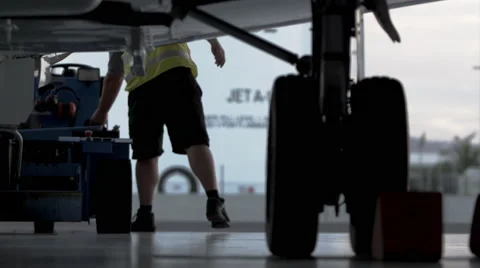 Aircraft engineer working on Private Jet landing gear Stock Footage 55692738