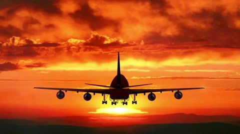 Aircraft flies into the sunset Stock Footage