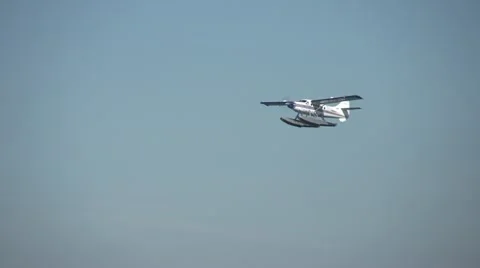 Aircraft, float plane in flight 2nd plane passes in bg Stock Footage
