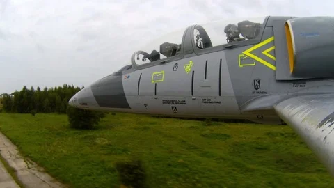 Aircraft fly quickly and low above the ground of aerodrome. Dangerous trick. Stock Footage 118676811