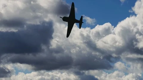 Aircraft Flying Against Dramatic Textured Cloudscape Slow Motion 4K Stock Footage 345062933