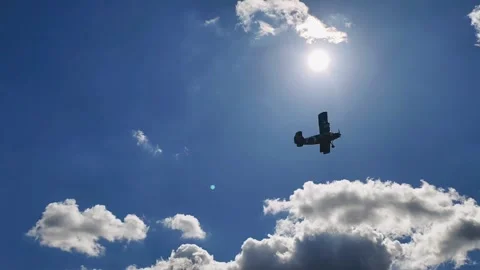 Aircraft Flying Against Dramatic Textured Cloudscape Slow Motion 4K Stock Footage 345064238