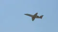 Aircraft flying close to earth, blue sky HD Footage