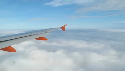 Aircraft flying in the clouds Stock Footage 10735599