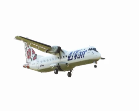 Aircraft flying low through sun beams with flare Stock Footage 32683439