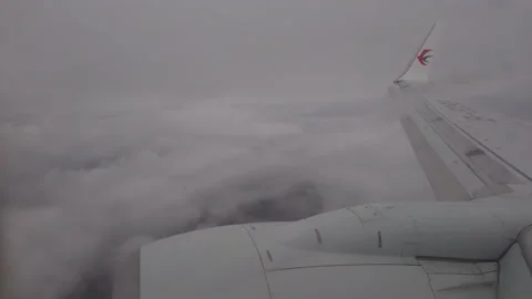 Aircraft flying in rain over cloudy sky. Stock Footage 244554925