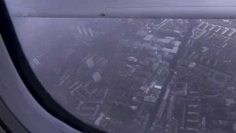 Aircraft flying through a cloud with a cityscape of London below Video stock 142709821