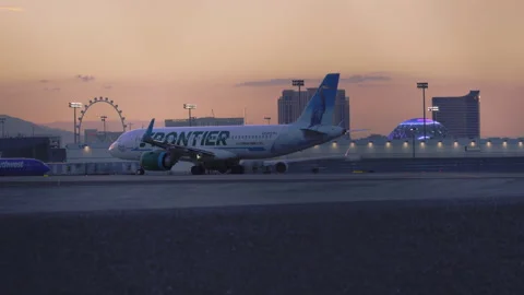 Aircraft Frontier airlines is preparing for take off Stock Footage 273632171