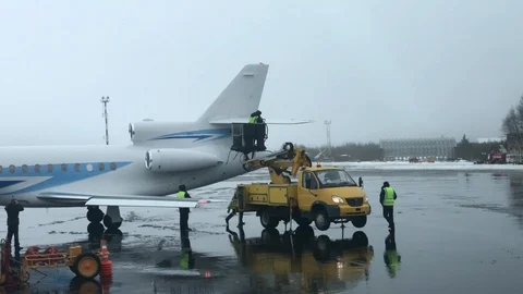 Aircraft handling anti ice processing at airport in the winter. Stock Footage 100628657