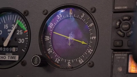 Aircraft Instrument Panel - Compass, Tachometer, And Control Panel On The Stock Footage 328387164