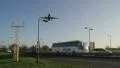 Aircraft landing over a busy road HD Footage