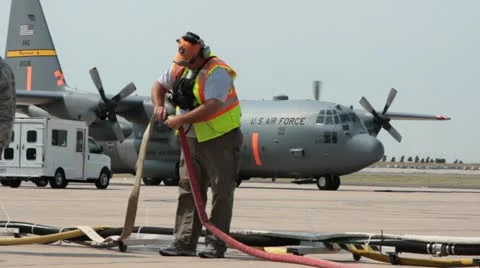 Aircraft maintenance with C130 in background (HD) c 스톡 동영상 11896700
