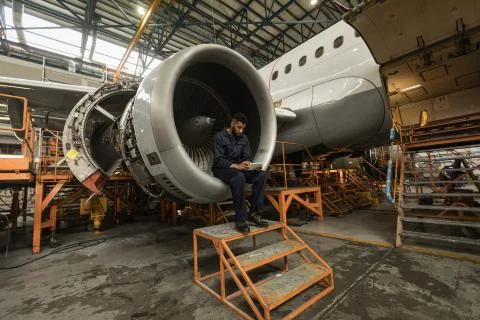 Aircraft maintenance engineer using digital tablet Stock Photos