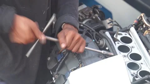 An aircraft mechanic works on an engine. Stockbeeldmateriaal 62519922