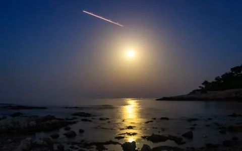 Aircraft over the moon by night - Nice France Stock Photos