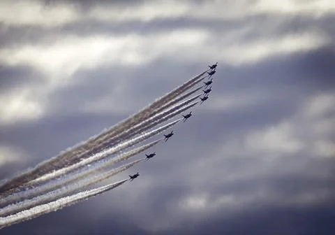 Aircraft performance and formation of 9 planes banking to form a stunning cur Stock Photos