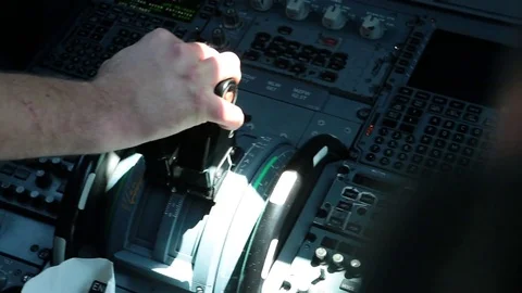 Aircraft pilot manipulates controls Stock Footage 77048302