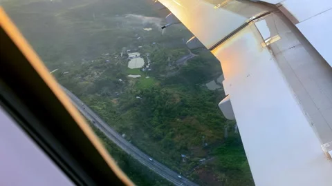 Aircraft plane Wing of flying  as seen by passenger through porthole windows 库存影片 264522351