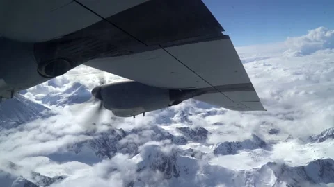 Aircraft Propeller During Flight Over Snowy Mountains Stock Footage 130360425