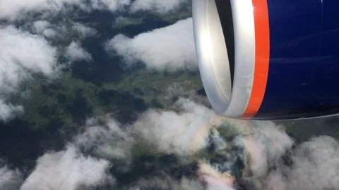 Aircraft shadow inside a rainbow halo shot from the airplane window Stock Footage 88939243