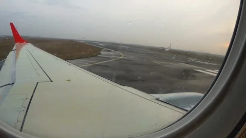 Aircraft start takeoff from airport Odessa. View from window of airplane. Stock Footage