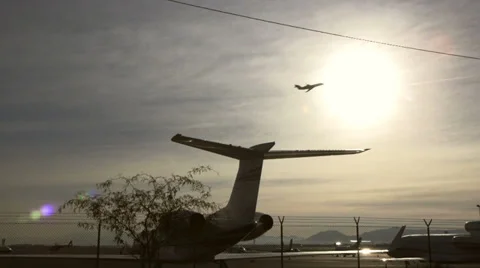 Aircraft Takeoff Through The Sun Video stock 37011286