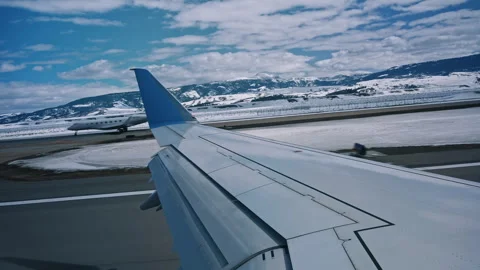 Aircraft Taking Off with Mountain View Jackson Hole Stock Footage 313484937