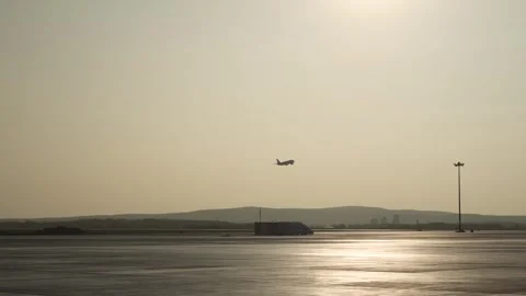 Aircraft is taking off. Side view from terminal. ontour light Stock Footage 255151332