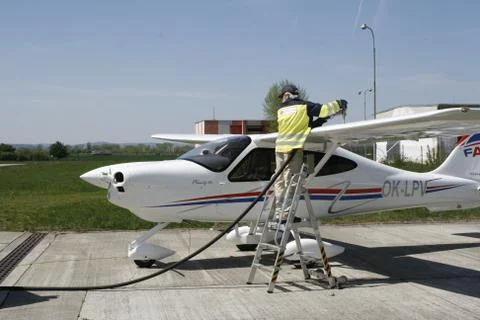 Aircraft Technician servicing the aircraft Stock Photos