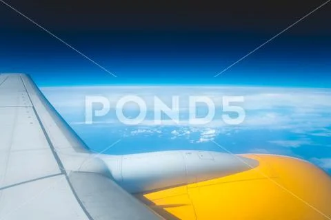 The aircraft wing against the background of cloud Stock Photos