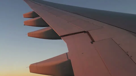 Aircraft wing and shadows running on it while turning Stock Footage 22871981