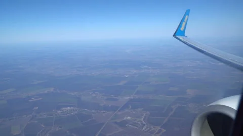 Aircraft Wing on blue sky background. This time in altitude during flight Video stock 88659419