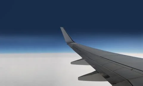 Aircraft wing on the clouds, Flying background horizontal. Beautiful view Stock Photos
