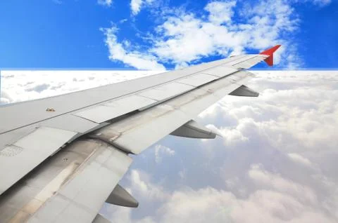 Aircraft wing on the clouds,flying background Stock Photos