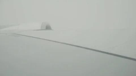 Aircraft wing flyes through the mist Stock-Footage 77646530