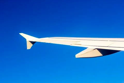 Aircraft wing some component of plane on during flying high above sky Fotos Stock
