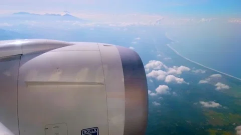 Aircraft wing view of clouds and coastline Stock Footage 171958195