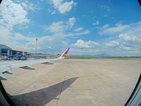Aircraft Wing View of a plane while flying in the sky Stock Photos