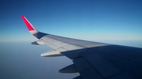 Aircraft wings are flying hovering with the sun rays of the sun are all over. Stock Footage 121734601