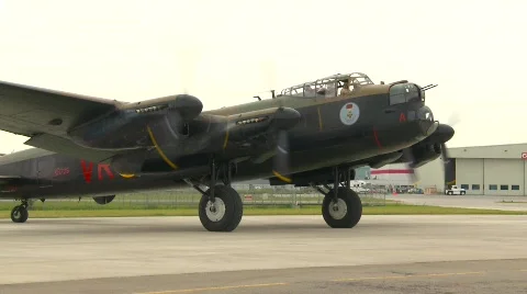 Aircraft, WWII Lancaster bomber, #26 taxi follow shot Stock Footage